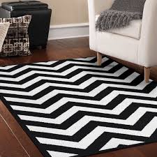They specialize in overstock and closeouts. A Bold Striped Rug That Instantly Modernizes Your Home Striped Rug Cheap Rugs Stripe Rug Living Room
