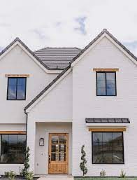 I tested some charcoal grays, warmer neutrals, and a true black. White Brick House With Black Trim Google Search White Exterior Houses Exterior Brick White Brick Houses