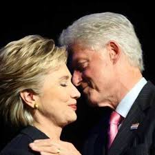 US Senator Hillary Clinton (L) is greeted by her husband former US  President Bill Clinton