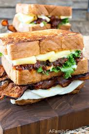 Our Grilled Cheese Club Sandwich Has Three Kinds Of Cheese Bacon And Tomato Jam Layered Between Crispy Toasted Bread Dinner Sandwiches Sandwiches Cheese Club