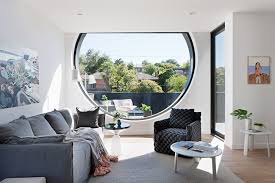 A popular way to enhance the design of an arch window is adding grids. Outstanding Round Window Design For Modern House