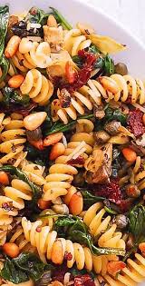 Italian Pasta With Spinach Artichokes Sun Dried Tomatoes Capers Garlic And Pine Nuts Fusilli Pasta Recipe Pasta Dishes Vegetarian Salad Recipes