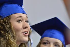 Savanah Baker checks the program during Saturday's…