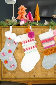 Diy Colorful Pom And Yarn Holiday Stockings Holiday Stockings Christmas Crafts Diy Christmas Stockings Diy