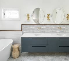 It's a true white ceramic wall tile in a traditional design and a new, modern color. Dark Gray Floating Dual Washstand With White Penny Tiles Transitional Bathroom