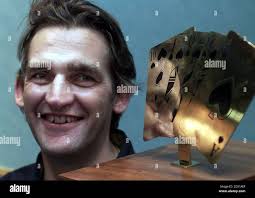 TV director John Duthie, 42, from London, with his trophy after he won the  Ladbroke's Casinos Poker Million tournament pocketing a cool 1 million, the  biggest ever prize for the card game