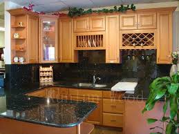 Classic dark oak cabinets with defined grains partnered with stark white quartz worktops are best for this aesthetic. Beech Cabinets With Dark Granite Tuscan Kitchen Kitchen Cabinets Home Depot Booth Seating In Kitchen