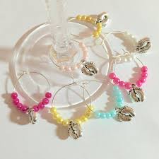 These sweet little sheep and white flower would be a thoughtful touch to any beverage served at a shower! 100 X Baby Shower Favour Wine Glass Charm Thank You Gift Of New Present Christenings New Baby Pa Wine Glass Charms Wedding Wine Glass Charms Baby Shower Favors