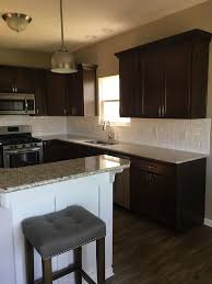 White Beveled Subway Tile Dark Cabinets Umber Light Granite Santa Cecilia White Bo White Beveled Subway Tile Backsplash With Dark Cabinets Dark Cabinets