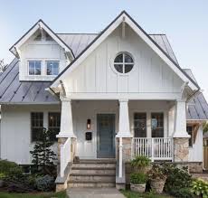 Charming White Craftsman House Exterior With Board And Batten Round Window And Ston In 2020 Craftsman Bungalow Exterior White Exterior Houses Craftsman Home Exterior