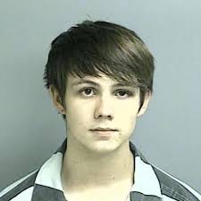 Huffman man accused of injuring, spitting