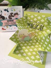 With the card stock folded at the center of that pop up triangle, cut the ends diagonally so that when it is opened it creates an hourglass shape when opened up. Learn How To Make An Explosion Card Stamping Country