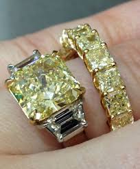 A Yellow Diamond And Diamond Engagement Ring With A Yellow Diamond Eternity Band Both By Sasha Primak Via Diamonds In The L Diamond Jewelry Beautiful Jewelry