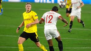 Dortmund's erling haaland, right, challenges for the ball with sevilla's jules kounde during the champions league, round of 16, first leg soccer match between sevilla and borussia dortmund at the ramon sanchez pizjuan stadium in seville, spain, wednesday, feb. Sevilla Borussia Dortmund Resumen Resultado Y Goles 2 3