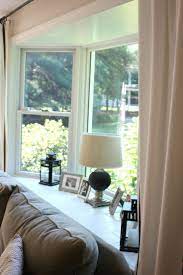 Customized bay window blinds ideas 12. 30 Bay Window Decorating Ideas That Blend The Functionality And Gorgeous Decor Into Co Bay Window Living Room Window Treatments Living Room Living Room Windows
