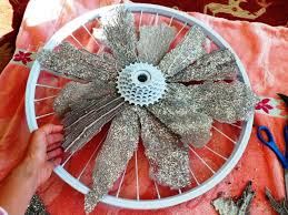 A surprising number of people want to learn how to build a bicycle wheel. How To Make A Wreath From A Bicycle Wheel Coral And Starfish Diy