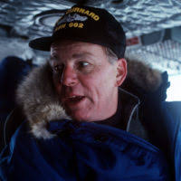 MASTER SGT. Mark Brotherton, an 8th Air Force buff, stands in front of the  B-17 used in the film "Memphis Belle," which is