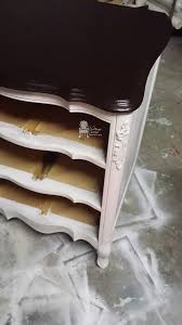 Probably some snotty kid that ruined the top back in the 80's when this style was popular. Painted French Provincial Triple Dresser