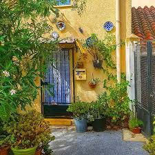 Welcome In Cyprien S Village And Discover Many Cute Details And Colors Pretty Cute Sweet Nice Colors Plants Heritage Catal South Of France Pretty Color