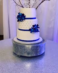 Ice blue wedding cake by rachels cakes via flickr change the colors to plum purple and blood red. Royal Blue And White Wedding Cake Video Royal Blue Wedding Cakes Wedding Cake Videos Wedding Cake Flowers Blue