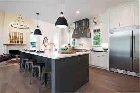 This kitchen was perfectly laid out for look and function. Benjamin Moore White Dove Perimeter Cabinet With Benjamin Moore Kendall Charcoal Modern Farmhouse Kitchens Bathroom Farmhouse Style Farmhouse Kitchen Lighting