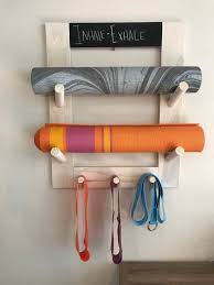 Wall Mounted Yoga Mat Holder With 3 Pegs Along The Bottom To Hold Your Yoga Mat Straps Fitness Bands Yoga Bag Wit Yoga Decor Yoga Mat Holder Workout Room Home