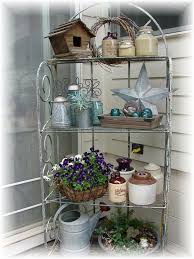 Ok I Got A Baker S Rack Today For My Front Porch Now Need Ideas Of What To Put On It Outdoor Bakers Rack Bakers Rack Decorating Deck Decorating