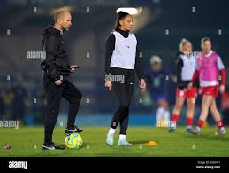 Durham Women head coach Adam Furness watching over the warm-up before the  Subway Women's League Cup quarter-final match at Kingsmeadow, Kingston upon  Thames. Picture date: Wednesday January 22, 2025 Stock Photo -