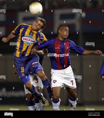 Argentinas Rosario Central Marco Ruben, left, battles for the ball against  Cerro Portenos Edgar Gonzalez, from Paraguay, during their second-round  Copa Libertadores match at Defensores del Chaco stadium in Asuncion,  Paraguay on