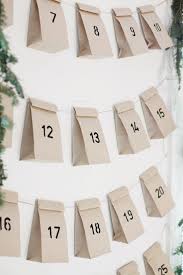 Simple Advent Calendar Made From Brown Paper Bags Stenciled Numbers And A Hanging Garland For Christmas Advent Christmas Advent Calendar Diy Advent Calendar