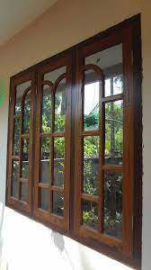The classic design of square wooden frames has been around for decades but its popularity this grill structure that works like a wall divider extending from floor to ceiling is modern in design and the perfect design can be created with both wood and iron depending in the security required and is. Top Wood Door Window Design 86 For Your Interior Designing Home Ideas With Wood Door Window Desig Indian Window Design Wooden Window Design House Window Design