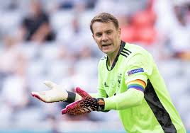 A man carries lgbt pride flags outside the allianz arena in munich before germany and hungary face. Ugh1l2wufeq0gm