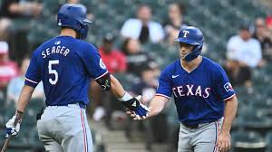 Two Rangers players on the field