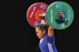 Hidilyn diaz celebrates after a lift during the group a women's 55 kg weightlifting event in the 2020 tokyo olympics in the tokyo international forum in japan on monday. Hidilyn Diaz Ends Pinoy Olympic Medal Drought Takes Silver In Weightlifting