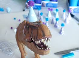 Glue the middle of the spikes to two of the strips: Dinosaur Party Hats Two Sisters