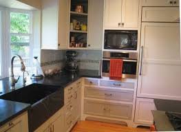 Opening up unimagined cooking possibilities in a small space. Miele Speed Oven Microwave And Sub Zero In Black And White Renovated Cook S K Kitchen Island With Sink And Dishwasher Kitchen Remodel Kitchen Island With Sink