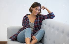 Positive Asian Girl In Casual Checkered Shirt And Jeans Posing Stock Photo Picture And Royalty Free Image Image 112957336 A lot of photographers have the job of shooting with everyday people and we need to make them look like models.