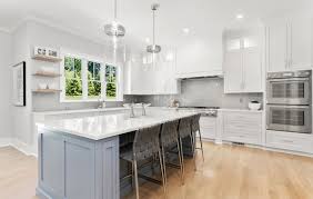 Newly stained wood floors, cabinetry painted gray and a custom wine closet transform this california kitchen. Two Tone Kitchen Cabinets Ideas Designs Colors Pictures