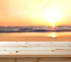 Aerial view of a young woman swimming with the donut swim ring in the clear blue sea with waves at sunset in summer. Wooden Table Top Against Blurred Sunset Beach Background Stock Photo Picture And Royalty Free Image Image 79246039
