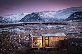 These towering prefab cabins are some of the most unique shelters we've ever seen. This Glass Cabin In Iceland Lets You Watch The Northern Lights From Your Bed