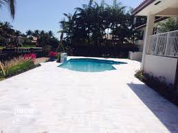 Installing a deck around your pool can create a striking focal point for your yard. Carrara White Marble Paver 6x12 Miami Travertine