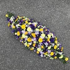 Funeral flowers delivered by best local florists | send funeral flowers to france to express your deepest sympathy purple funeral spray from 66.95 € next available delivery on 17. Yellow And Mauve Coffin Spray Buy Online Or Call 01474 355007