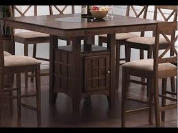 A convenient storage unit down below provides a versatile space to store serving essentials, while a subtle gray finish gives it a cool, modern look. Counter Height Table With Storage Youtube