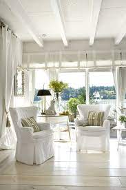 Beautiful yellow living room with white beams on the ceiling, crown molding and a fireplace. 13 Ways To Add Ceiling Beams To Any Room Town Country Living
