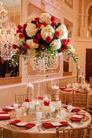 Regal With Red And Roses Bustld Planning Your Wedding Just Got Easier Red Wedding Decorations Red And White Wedding Decorations White Wedding Centerpieces