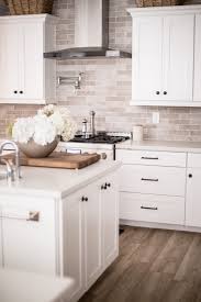 A popular choice for modern kitchens, the black handles (or knobs) provide a great contrast with the bright white of the cabinet. Black Kitchen Hardware Update