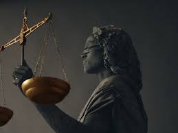 Lady justice, a blindfolded woman carrying a sword and a set of scales, is a common symbol on courthouses in america and inside some court rooms. 012 Lady Justice I Living Sculptures