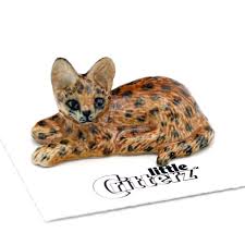Serval cats are domesticated in some households, but they are still wild animals. Pounce African Serval Porcelain Animal Figurines