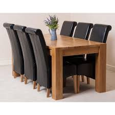 As one of the leading oak dining table suppliers in the uk, we understand the importance of having a dining table set that matches, that is why all of no matter what type of finish you are looking for, you are sure to find the best dining table and chairs for your needs and requirements when you choose. Kuba Large Oak Dining Table With 6 Montana Black Leather Chairs Oak Furniture King