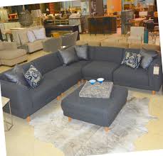 five piece grey sectional and ottoman